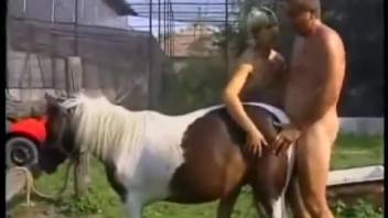 Overweight man aggressively penetrated his beautiful horse in the doggy style position
