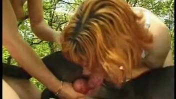 Experienced zoophile whore performs excellent oral on a black dog